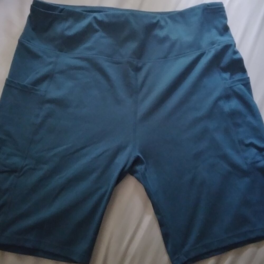 Teal athleisure shorts with hip and side pockets